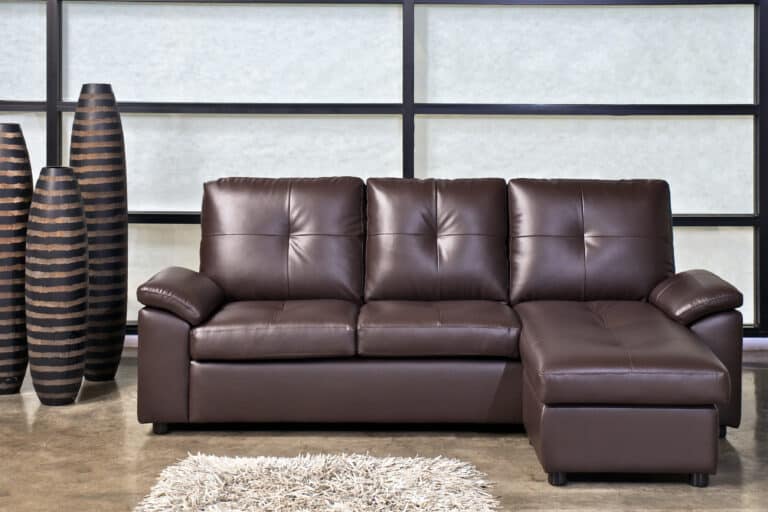 brown leather sofa with stool